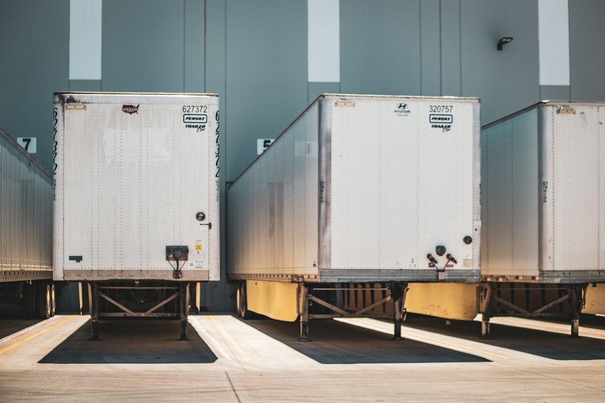 Trailers backed into a distribution warehouse loading dock