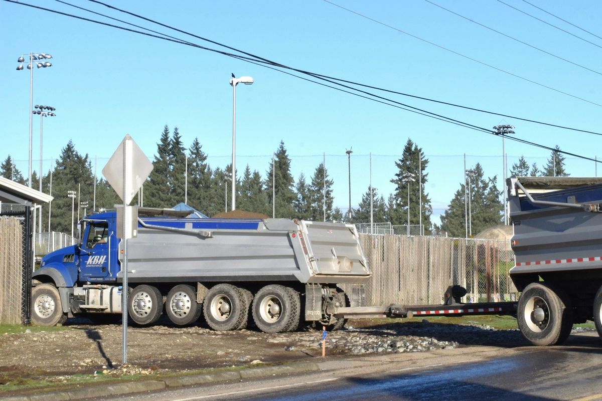 Heavy-duty dump trucks on a job site